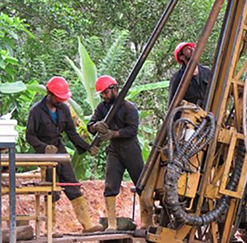 Drillers operating the MD600 diamond drill rig